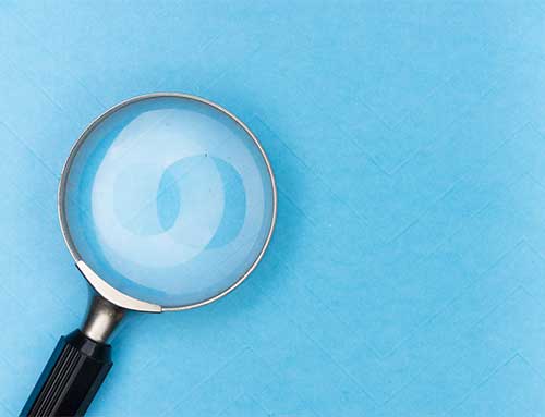 ERP project scoping - a magnifying glass on a blue background