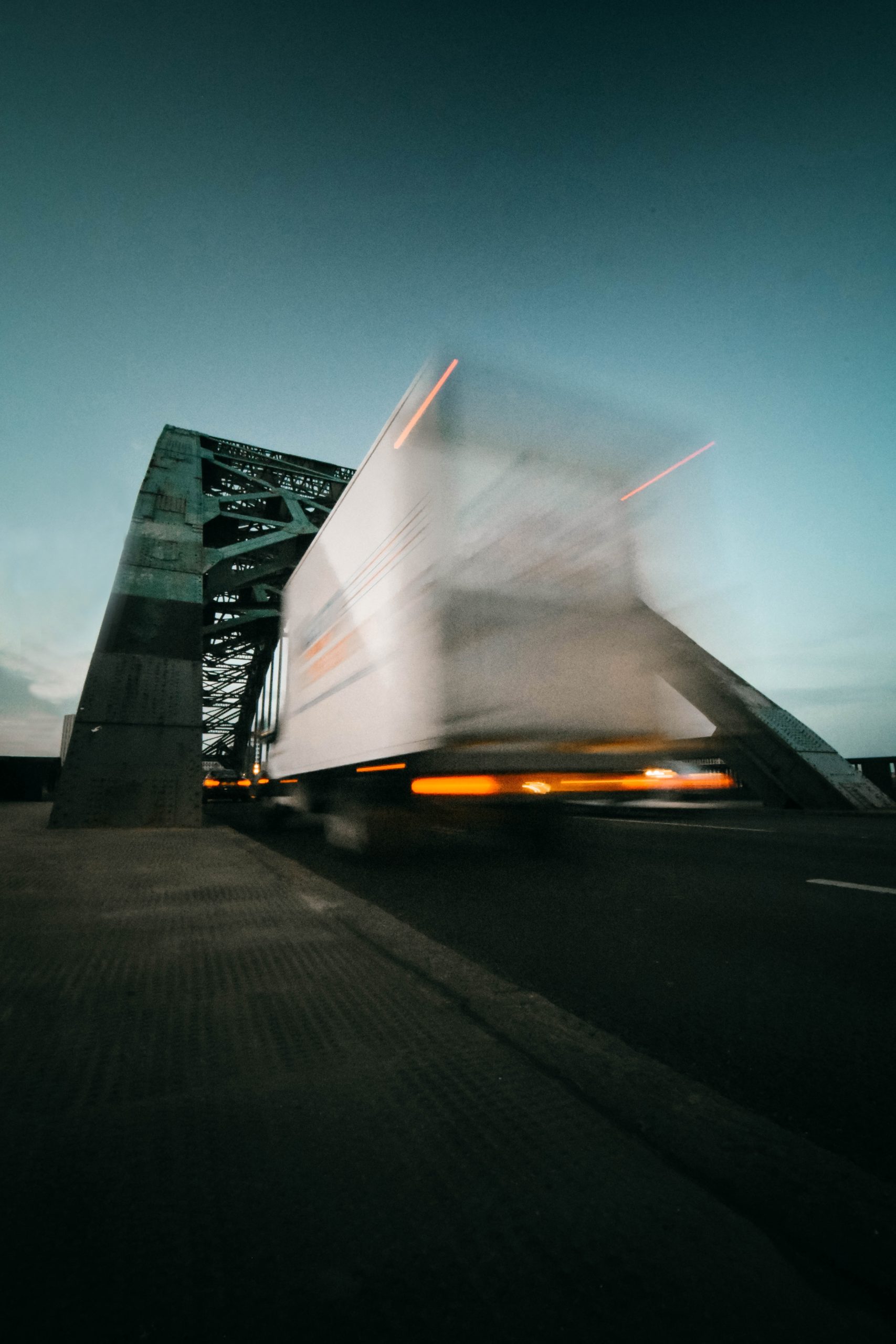 Agile supply chain - white truck moving on a bridge