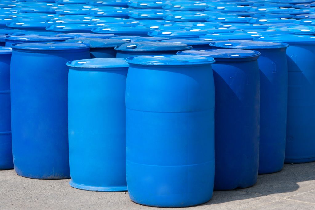Blue barrels depicting chemical plant