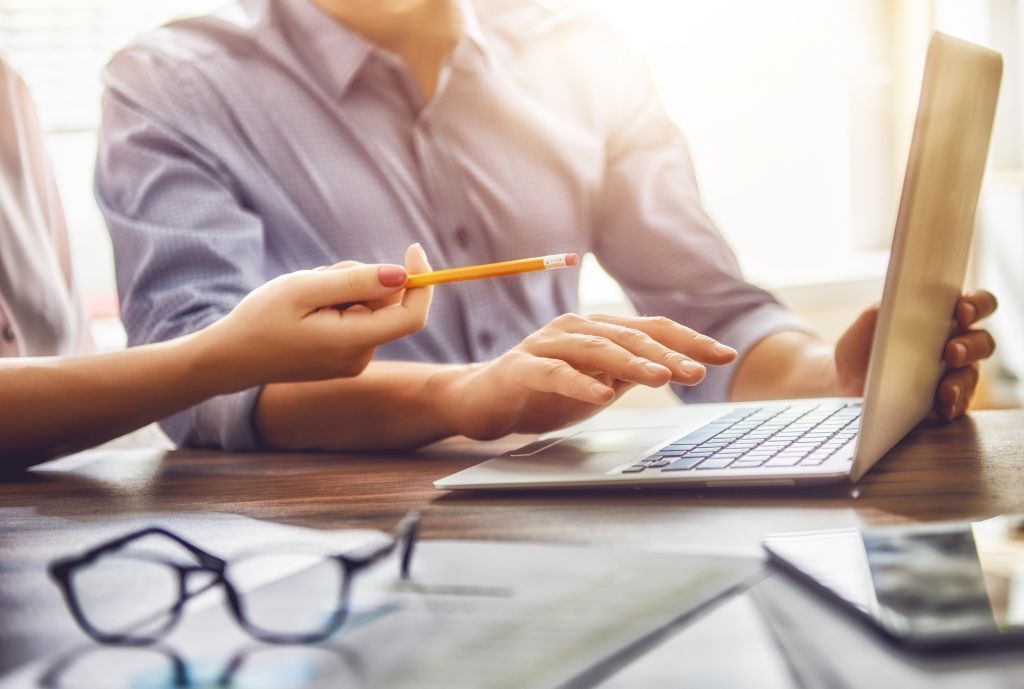 man and woman working in the office