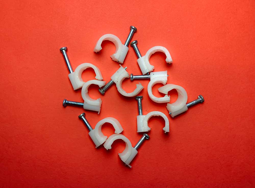 Talon-Manufacturing-Nail-in-Clips Nail in Clips on red background